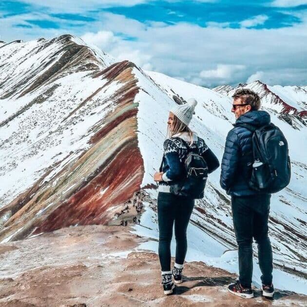 Travelers discovering Vinicunca
