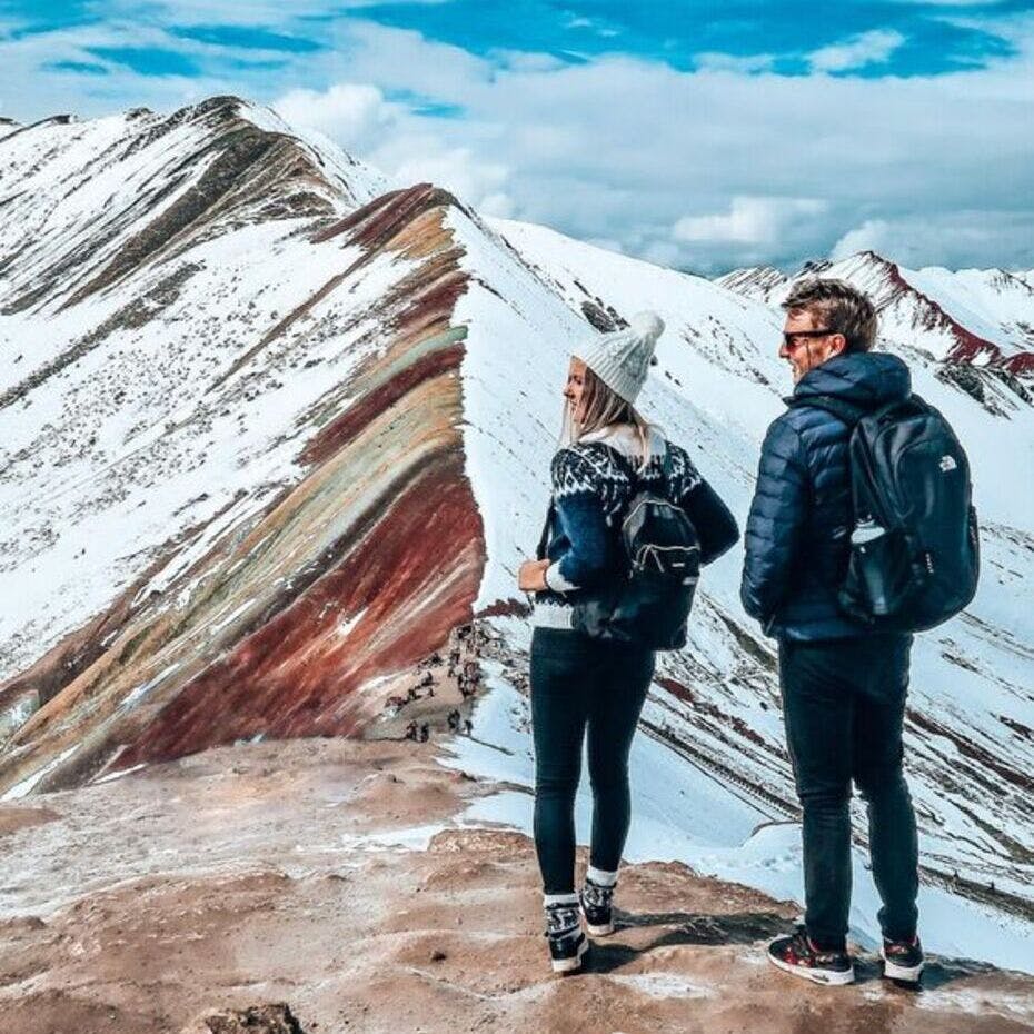 Travelers discovering Vinicunca